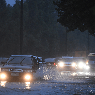 Cars driving through rainwater